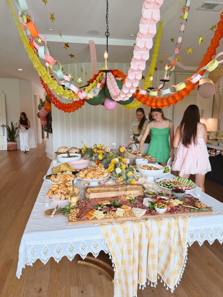 decorated party table of food and streamers