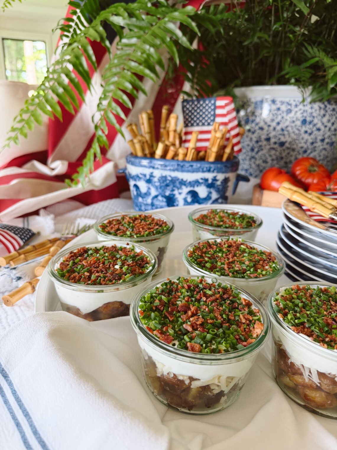 fourth of july table with crispy potato parfaits in glass jars