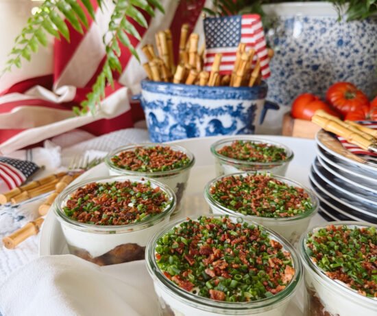 fourth of july table with crispy potato parfaits in glass jars