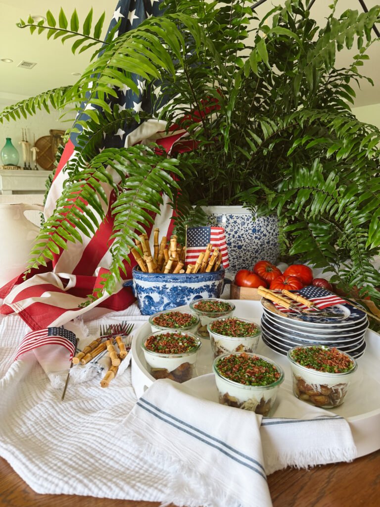 fourth of july table with crispy potato parfaits on a white tray with american flags