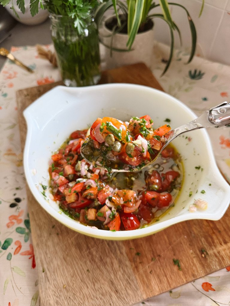 no cook vierge sauce with tomatoes, herbs, garlic, olive oil in white bowl