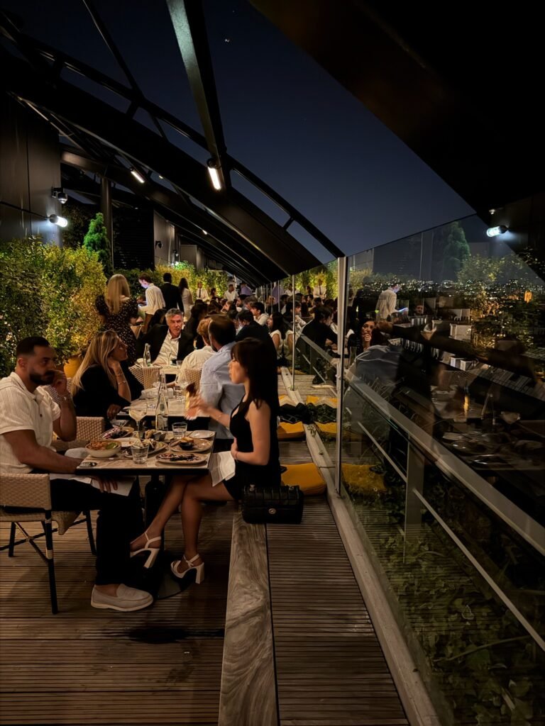 rooftop bar scene people enjoying apéro hour
