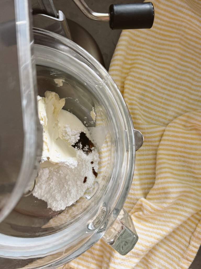 whipped cream in stand mixer with vanilla