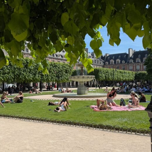 people on blankets in the sun in a Paris park