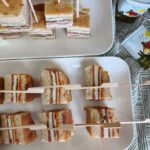 french pressed brick sandwich, layered antipasta sandwiches on tray, easy appetizer, school lunch