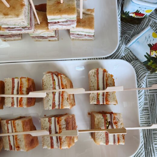 french pressed brick sandwich, layered antipasta sandwiches on tray, easy appetizer, school lunch