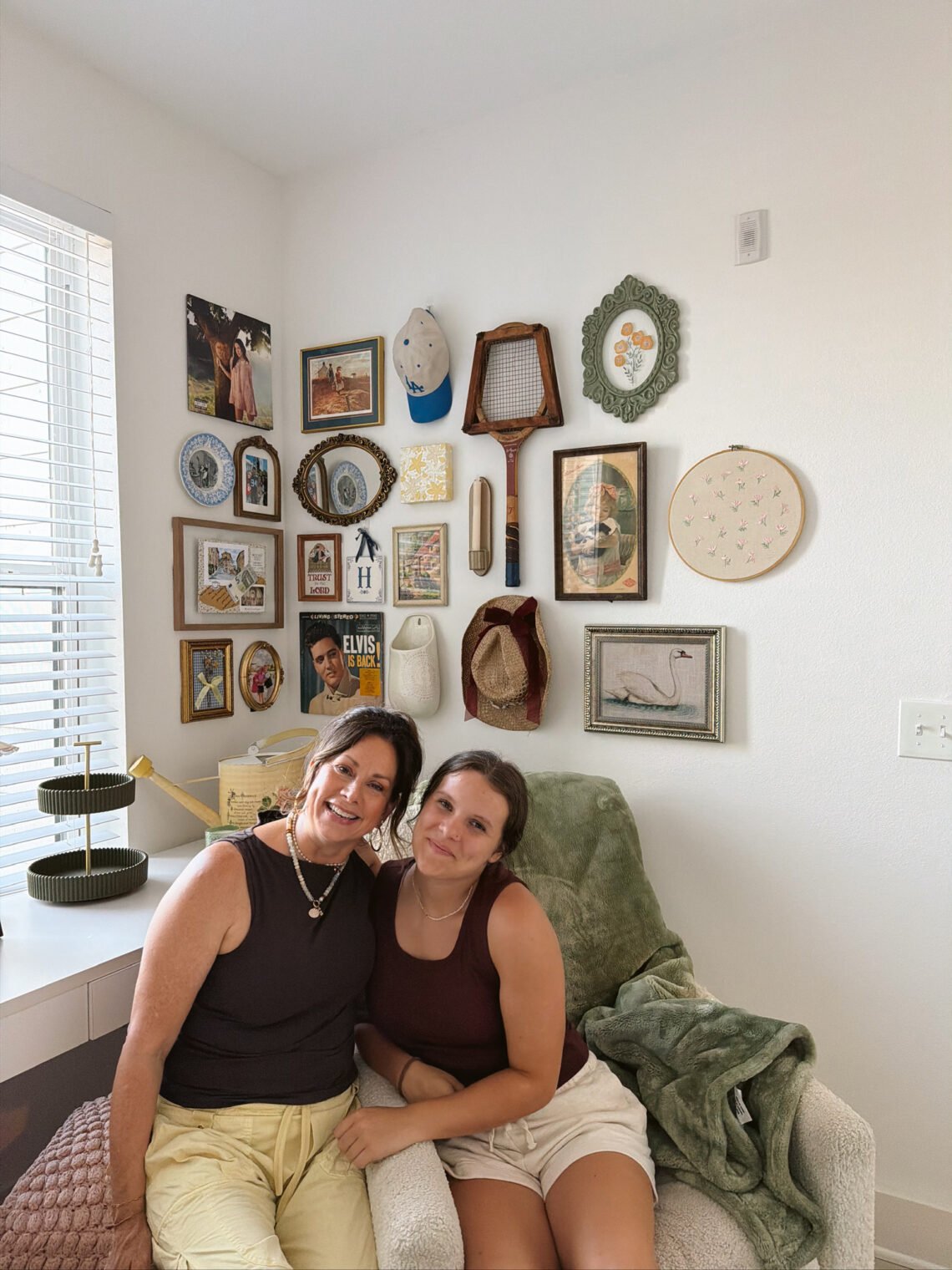 mother/daughter college apartment with collage wall