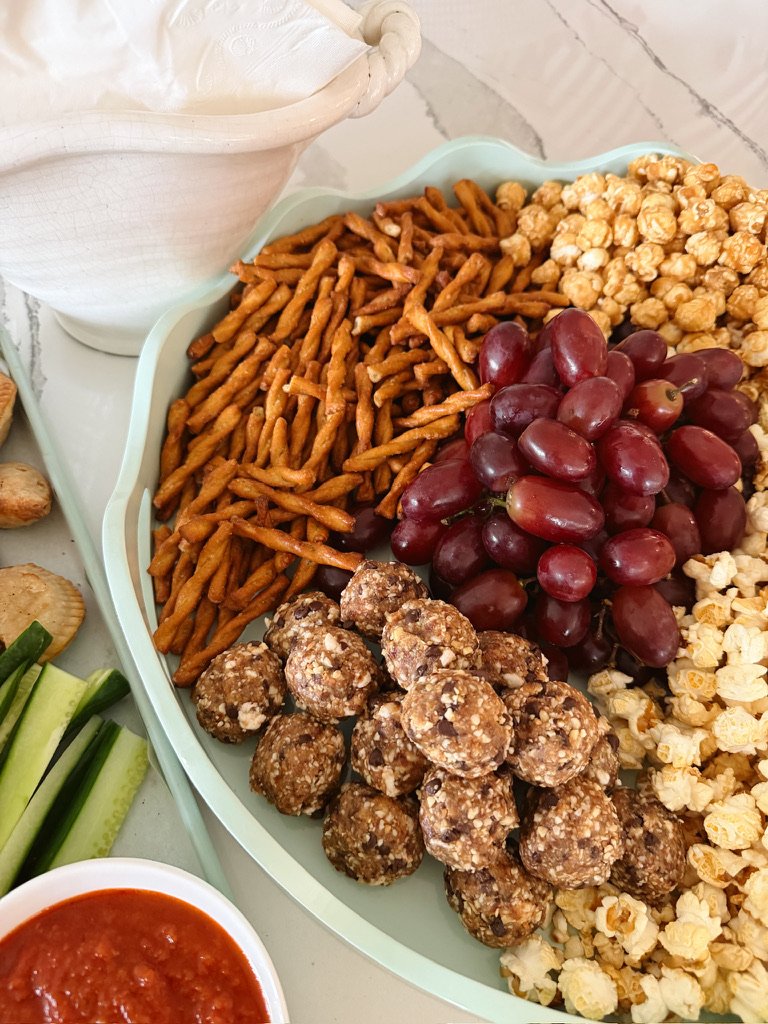 after school snack board, pretzels, popcorn, protein bites