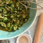 spicy cucumber salad in mint green bowl